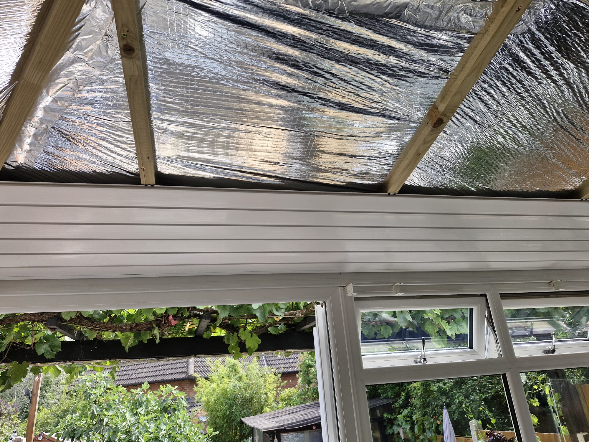 White UPVC ceiling panels being installed