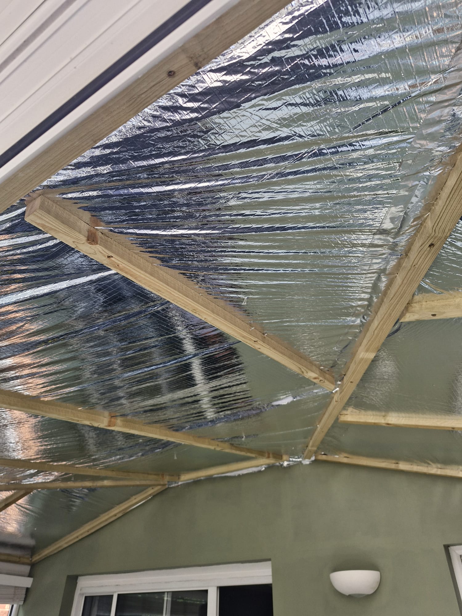 Timber subframe fixed to conservatory rafters
