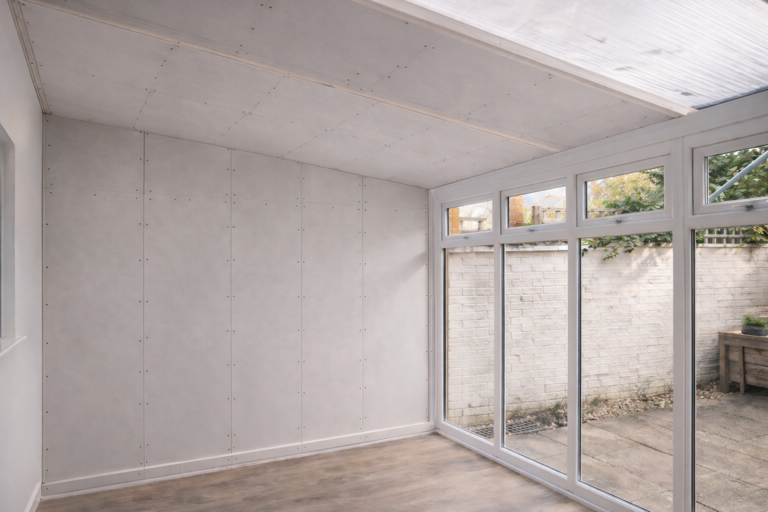 Plasterboard being installed and fixed to ceiling and walls