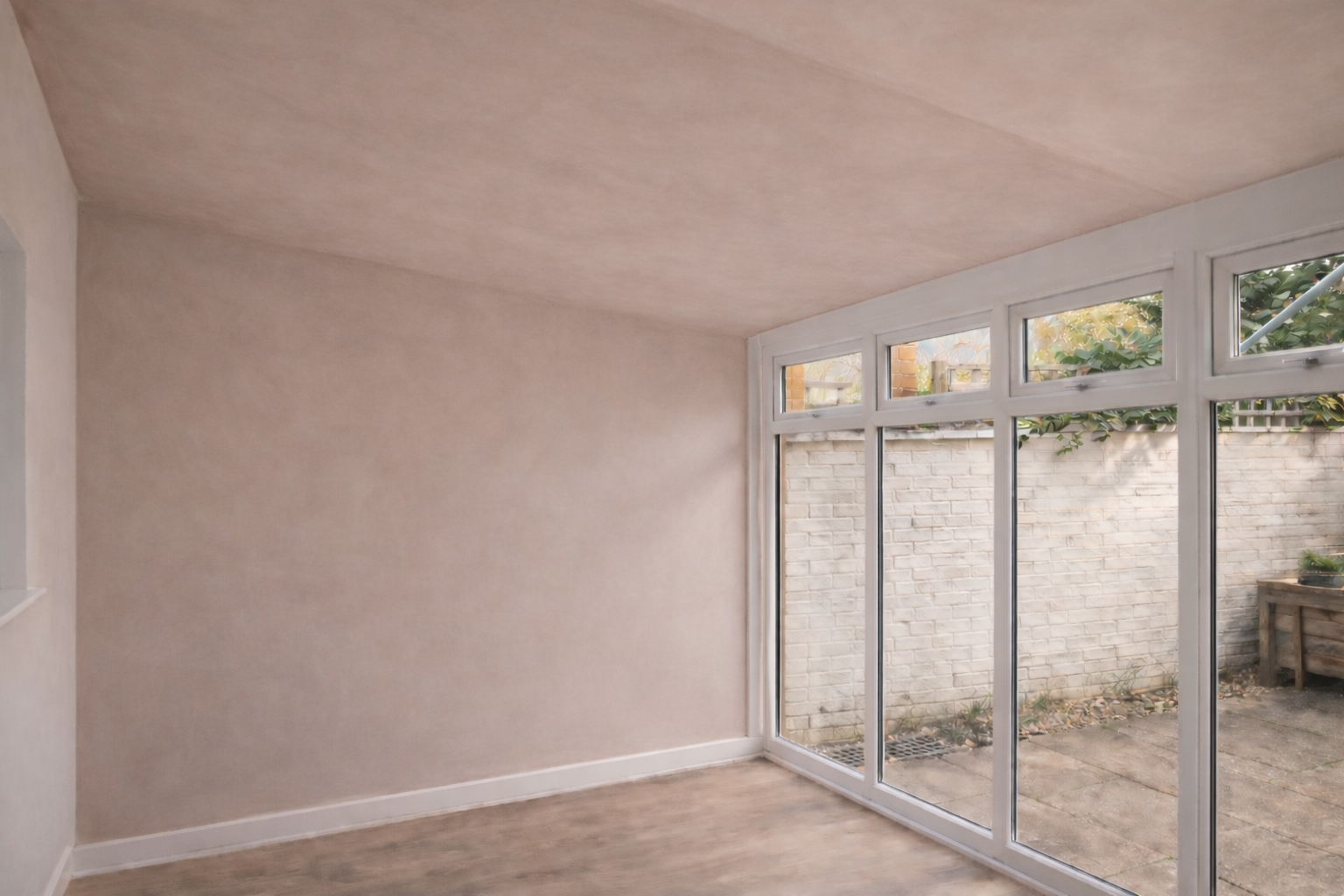 Fresh plaster skim applied to ceiling and walls by plasterer
