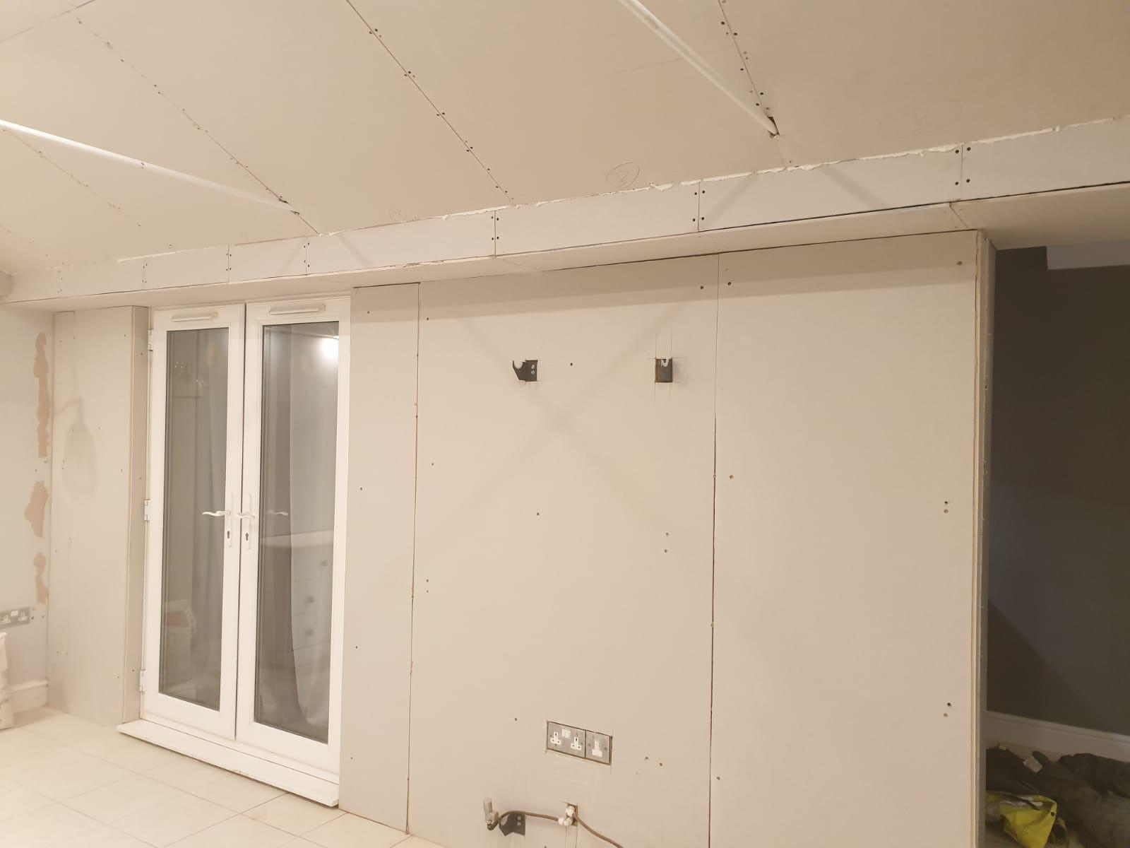 Plasterboard ceiling and walls going up