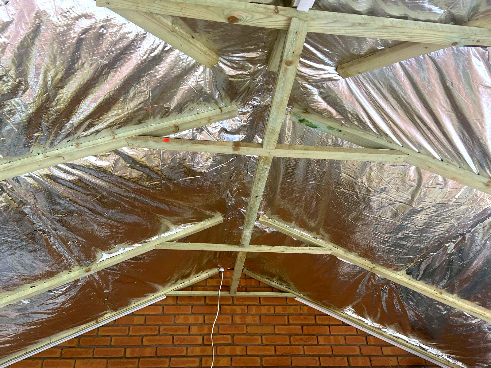 Timber battens and multifoil insulation being fitted to ceiling